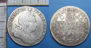 1723 - 1 shilling, stříbro - Jiří I., Velká Británie, SSC varianta byla ražena stříbrem objeveným South Sea Company v Indonésii